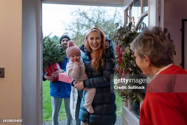 oh it's lovely to see you! - multi generation family winter stock pictures, royalty-free photos & images