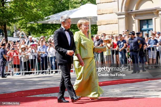 Former German Federal Chancellor Angela Merkel and her husband Joachim Sauer attend the Bayreuth Festival 2022 Opening And State Reception on July...