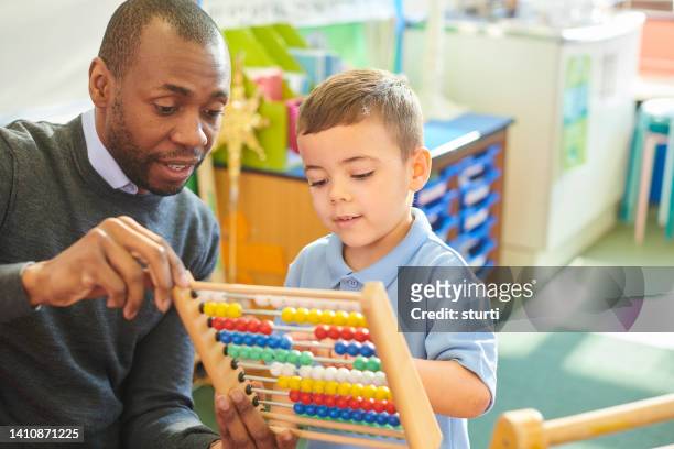 abacus in the classroom - abacus stock pictures, royalty-free photos & images