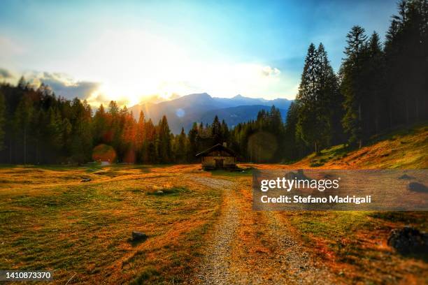 dolomites natural park with mountain hut - alm hütte stock-fotos und bilder