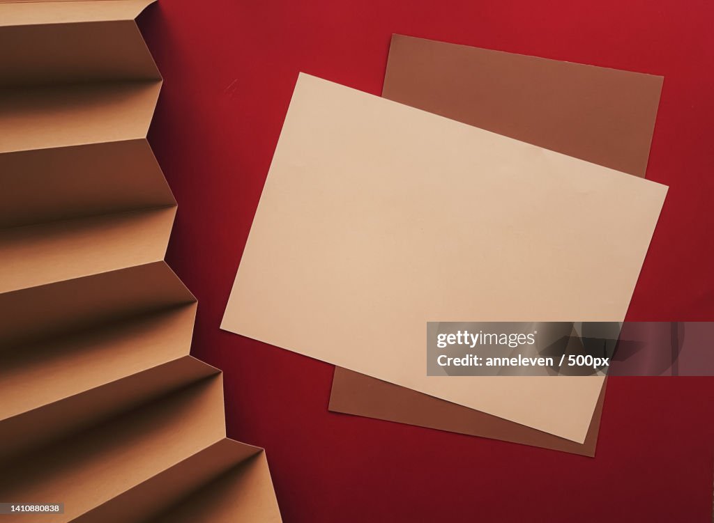 Beige and brown A4 papers as office stationery flatlay,Luxury