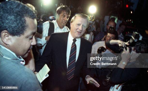 Yankees George Steinbrenner wades through a sea of media after agreeing to resign by August 20th as controlling owner of the New York Yankees for his...