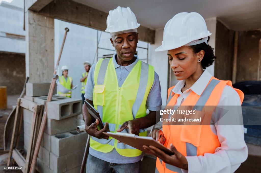 Manager Checking Work On Construction Site High-Res Stock Photo - Getty ...