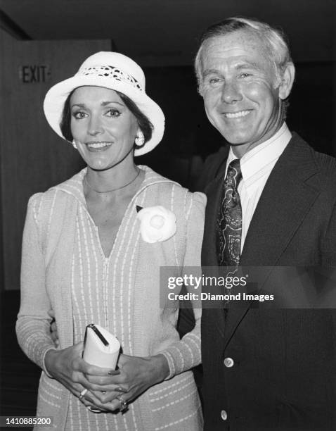Television host Johnny Carson poses for a portrait with his third wife, Joanna Holland in Los Angeles, California.