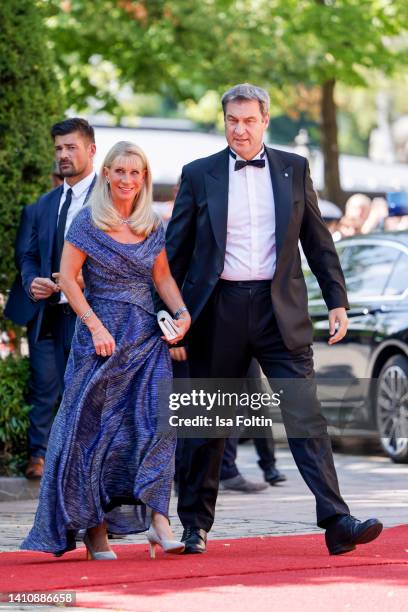 Bavarian Prime Minister Markus Soeder and his wife Karin Baumueller-Soeder attend the Bayreuth Festival 2022 Opening And State Reception on July 25,...