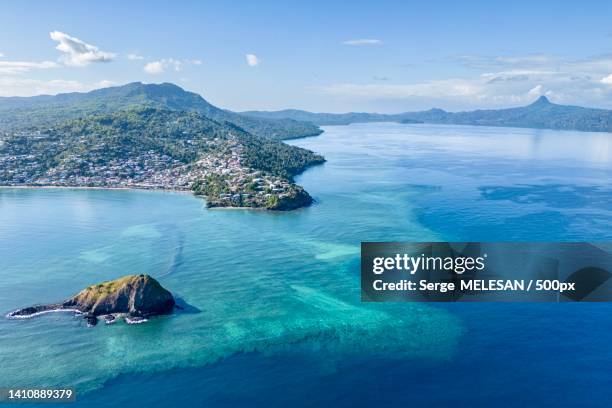 aerial view of sea and mountains against sky,mayotte - mayotte stock pictures, royalty-free photos & images