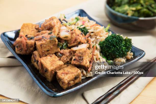 close-up of food in plate on table - fried rice stock-fotos und bilder