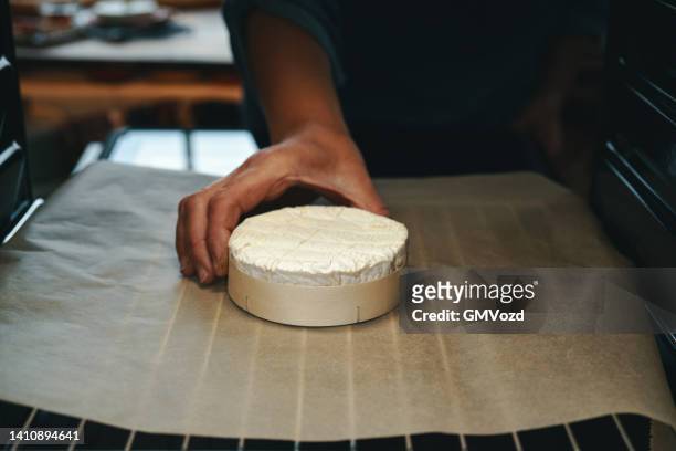 preparing baked camembert cheese with fresh figs - baked brie stock pictures, royalty-free photos & images