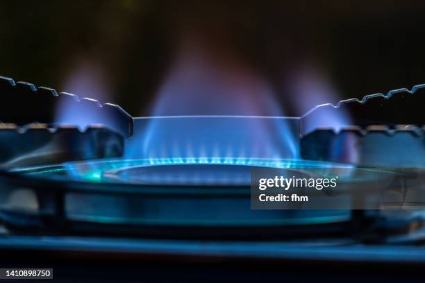 gas stove with flame - gas cooking stock-fotos und bilder