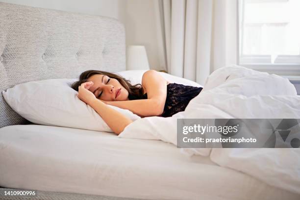 young woman sleeping in her bed - beautiful czech women 個照片及圖片檔