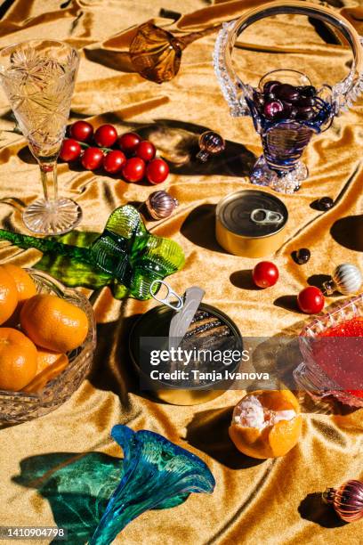 xmas modern dinner table setting on gold velvet fabric background. creative merry christmas celebration concept. contemporary new year festive backdrop - christmas still life fotografías e imágenes de stock