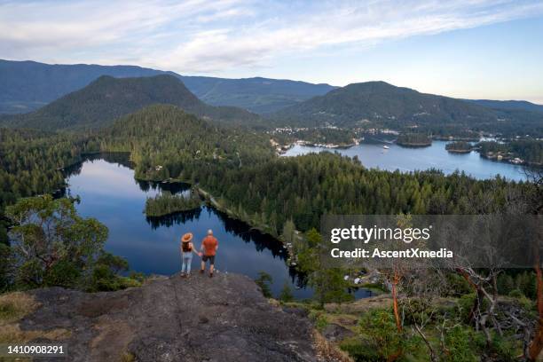 couple exploring nature - british columbia stock pictures, royalty-free photos & images