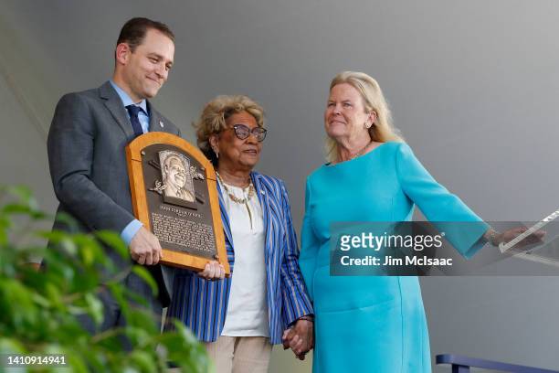 Dr. Angela Terry, niece of inductee Buck O'Neil, accepts his plaque from Hall of Fame President Josh Rawitch and Chairman of the Board Jane Forbes...