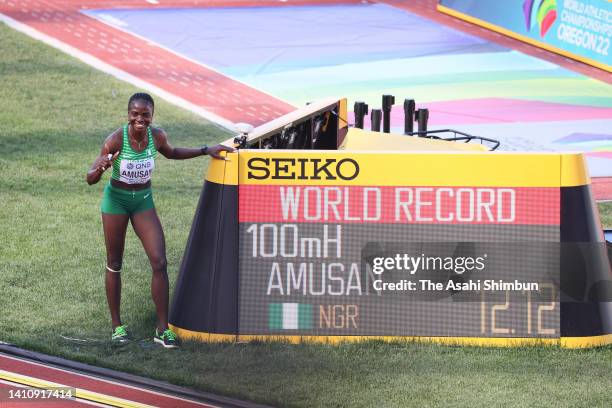 Tobi Amusan of Team Nigeria poses with her world record in the Women's 100m Hurdles Semi-Final on day ten of the World Athletics Championships...