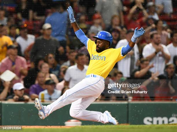 Jackie Bradley Jr. #19 of the Boston Red Sox scores on an RBI single off the bat of Yolmer Sanchez against the Cleveland Guardians in the third...