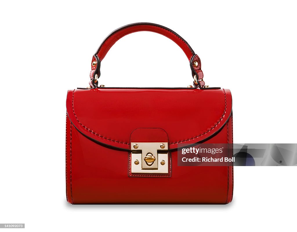 A red handbag on a white background.