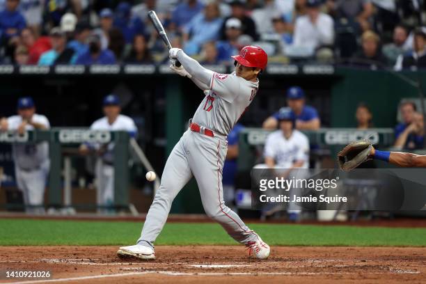 Shohei Ohtani of Japan of the Los Angeles Angels takes a ball off the knee during the 3rd inning of the game against the Kansas City Royals at...