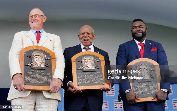 Jim Kaat, Tony Oliva and David Ortiz pose for a photograph with their plaques after the Baseball Hall of Fame induction ceremony at Clark Sports...
