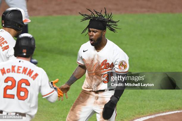 Cedric Mullins of the Baltimore Orioles celebrates scoring on Ryan Mountcastle single in the fifth inning during a baseball game against the Tampa...