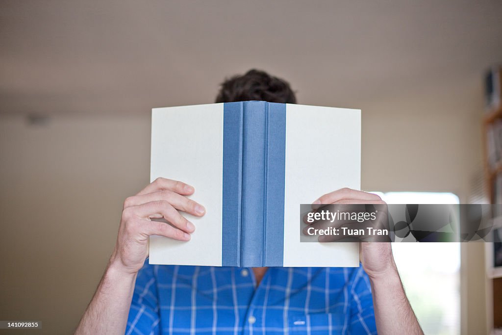 Man holding open book