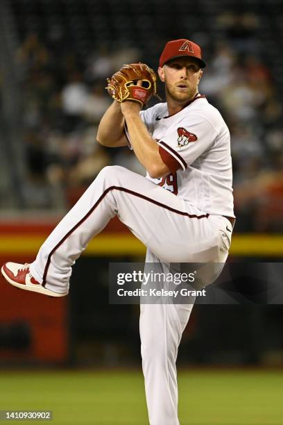 Starting pitcher Merrill Kelly of the Arizona Diamondbacks pitches against the San Francisco Giants during the first inning of the MLB game at Chase...