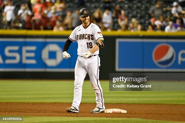 Carson Kelly of the Arizona Diamondbacks reacts after hitting an RBI double against the San Francisco Giants during the sixth inning of the MLB game...