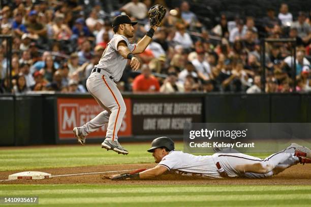 Josh Rojas of the Arizona Diamondbacks slides into third base against David Villar of the San Francisco Giants during the sixth inning of the MLB...