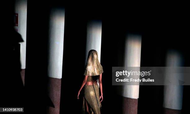 Model presents creations by Colombian Juan Pablo Socarras during the 'A-Mar' catwalk of the Historias Hechas a Mano project at the inaugural show...