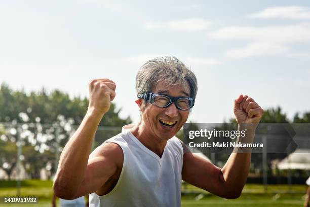 a middle-aged uncle who enjoys playing soccer on holidays. - hero images stock pictures, royalty-free photos & images