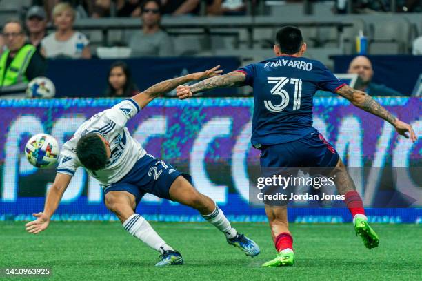 Ryan Raposo of the Vancouver Whitecaps fights for the ball with Federico Navarro during the game between Vancouver Whitecaps and the Chicago Fire FC...