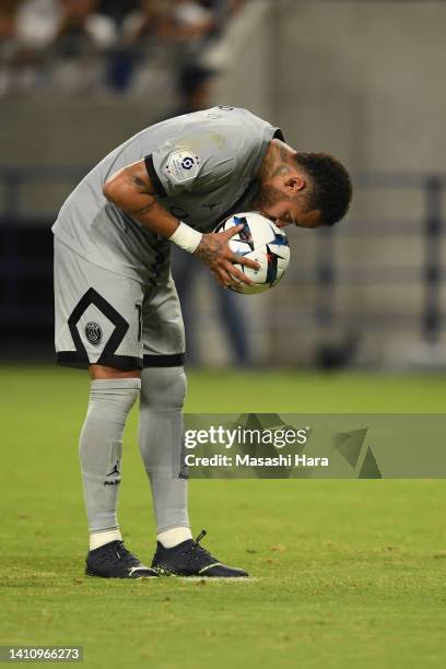 Neymar Jr of PSG kisses the ball before penalty kick during the preseason friendly between Paris Saint-Germain and Gamba Osaka at Panasonic Stadium...