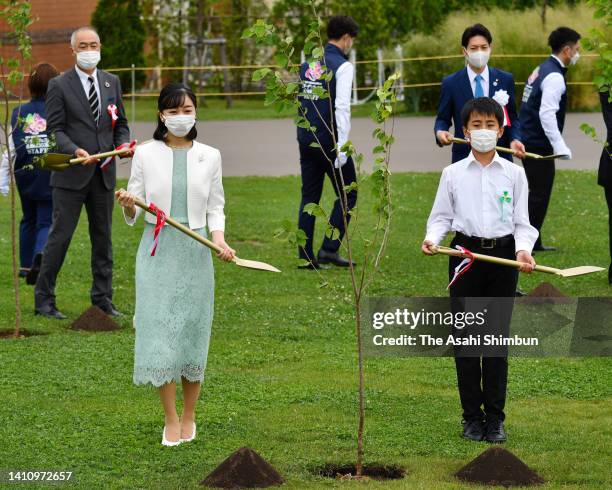 Princess Kako of Akishino plants a tree during the National Urban Greening Fair on July 13, 2022 in Eniwa, Hokkaido, Japan.