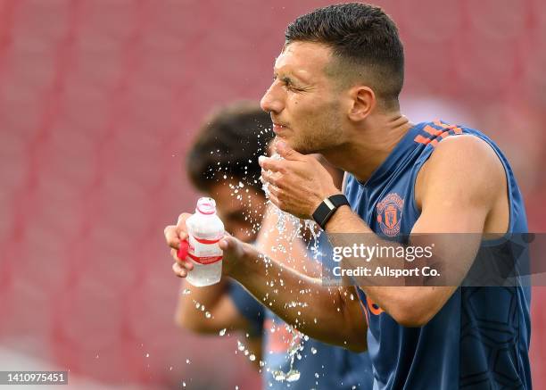 Diogo Dalot of Manchester United takes a drink during their open training session at the Rajamangala Stadium on July 11, 2022 in Bangkok, Thailand. D
