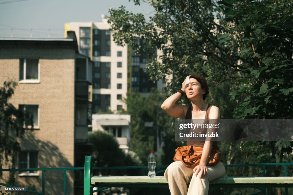 Woman suffering from heat wave