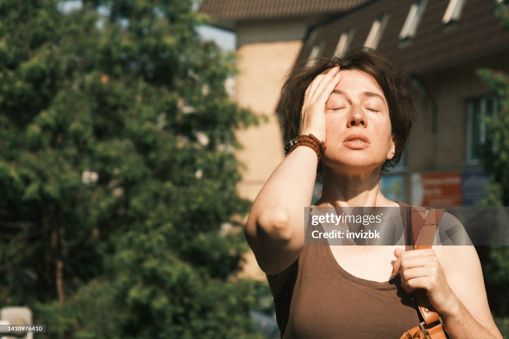 Woman suffering from heat wave