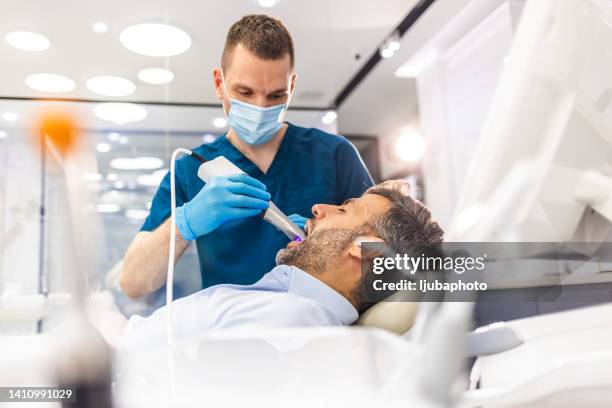 dental procedure with the help of 3d tooth scanner technology - dental health stock pictures, royalty-free photos & images