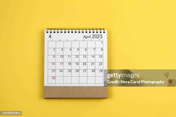april 2023 calendar on blue background - tax time stock pictures, royalty-free photos & images