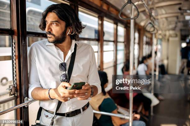 be worth connecting with - man riding bus stock pictures, royalty-free photos & images