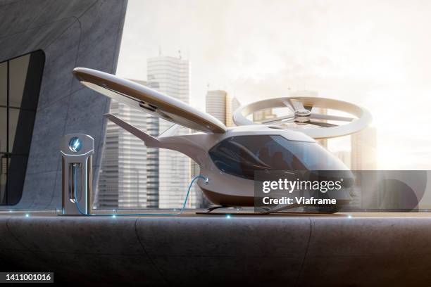 evtol helipad city - helicopter rotors stock-fotos und bilder