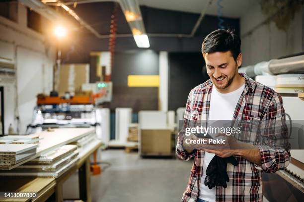 taking a little break - texting at work stockfoto's en -beelden