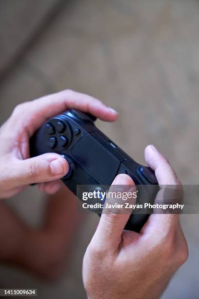 man hands holding a game controller - joystick stock pictures, royalty-free photos & images