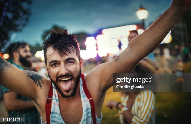 group of friends chilling before a concert. - man tongue stock pictures, royalty-free photos & images