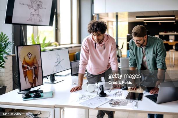 digital creator designers at work - game console stockfoto's en -beelden