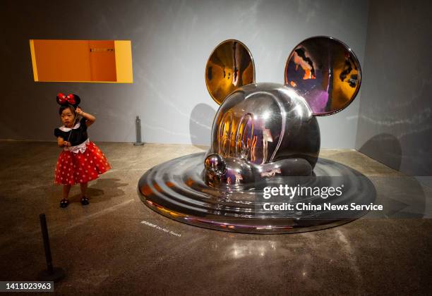 People visit the "Mickey: The True Original & Ever Curious" exhibition at 798 Art Zone on July 26, 2022 in Beijing, China.