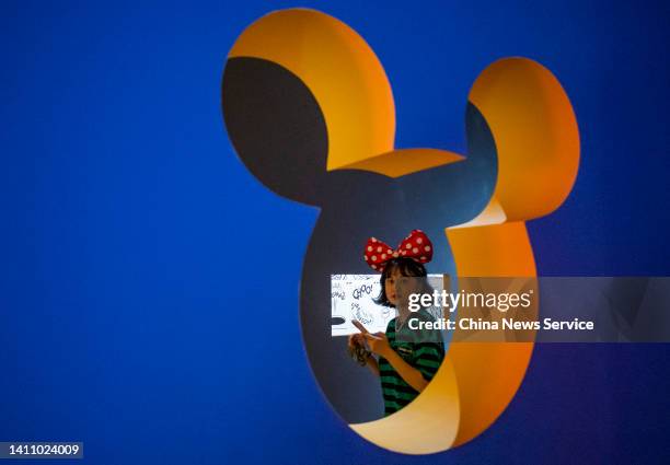 People visit the "Mickey: The True Original & Ever Curious" exhibition at 798 Art Zone on July 26, 2022 in Beijing, China.