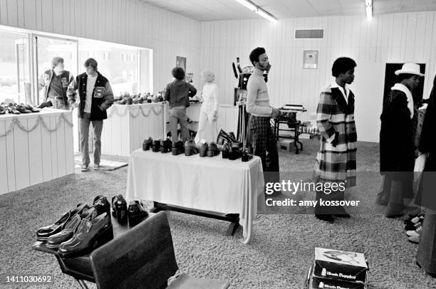 An interior view of a men's shoe store in downtown Macon, Georgia. Circa 1975.