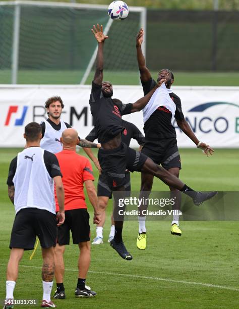 Fikayo Tomori and Tiémoué Bakayoko of AC Milan compete for the ball during the AC Milan training session on July 26, 2022 in Villach, Austria.