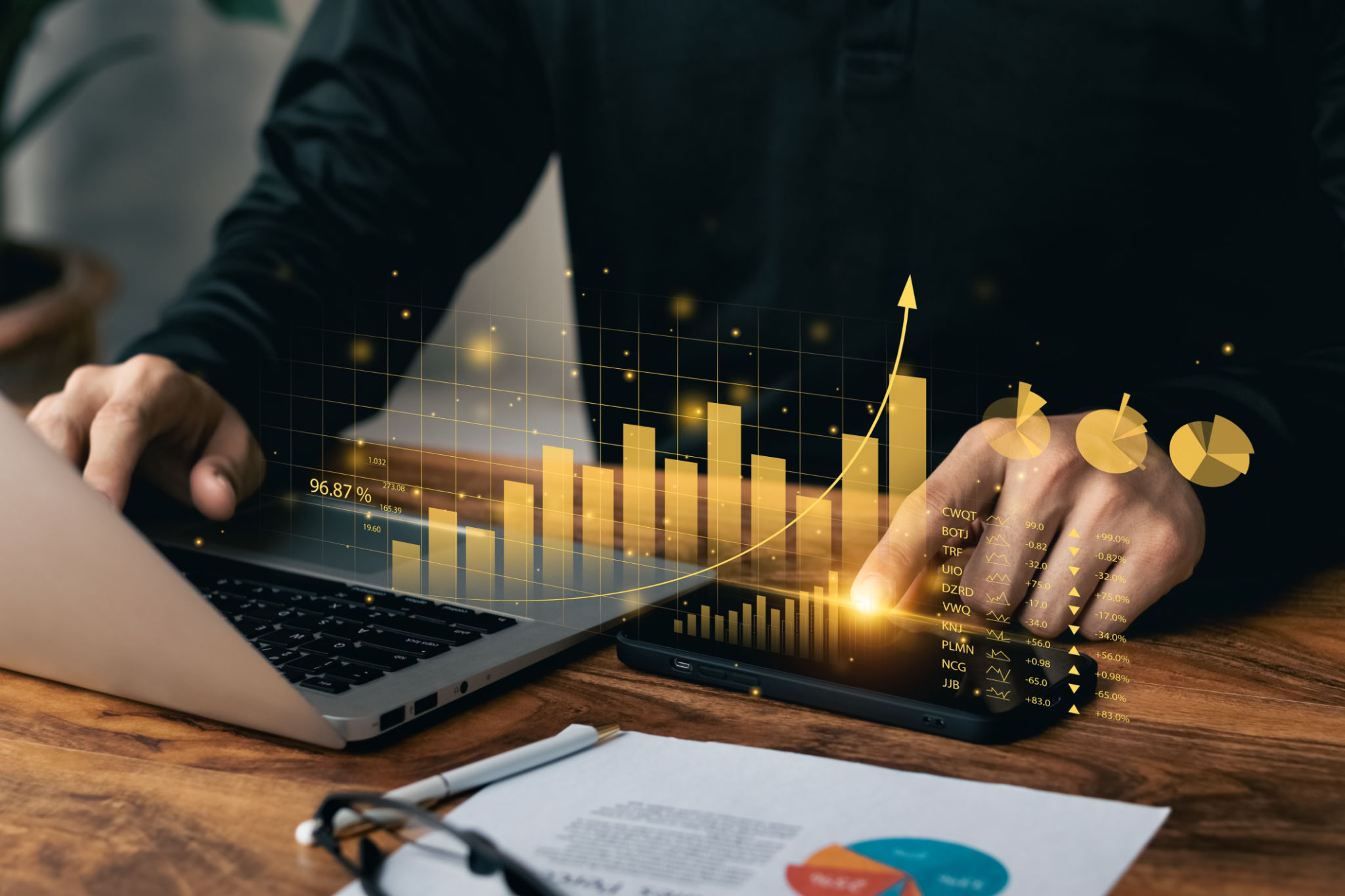 Businessman working with laptop and smartphone virtual dashboard analyzing finance sales data and economic growth graph chart. Businessman working with laptop and smartphone virtual dashboard analyzing finance sales data and economic growth graph chart.