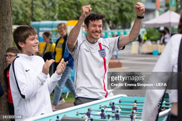 England fans play table football at the Fan Festival in Devonshire Green on July 26, 2022 in Sheffield, England.