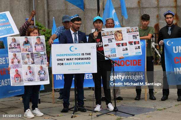 Tursunay Ziyawududn, an Uyghurs woman who spent one year in a forced labor camp, speaks about her experience as people gather for a rally against the...
